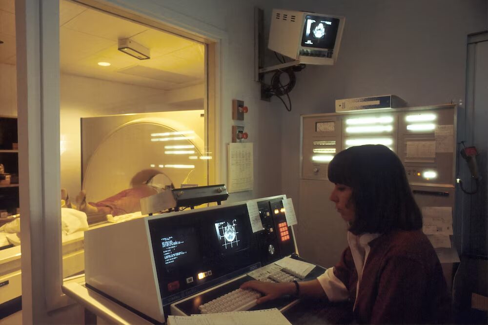 A radiology tech using an MRI machine