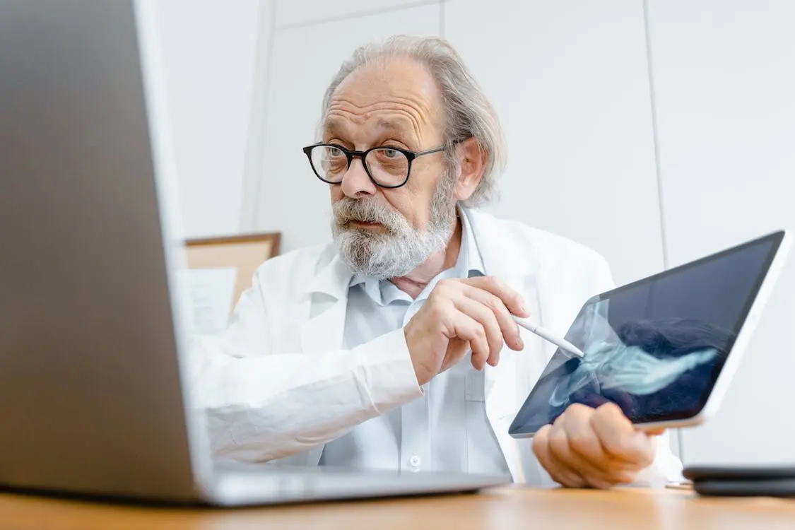 a doctor explaining a digital x-ray